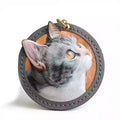 Personalized leather pet portrait keychain with 3D cat design and stitched round edge.
