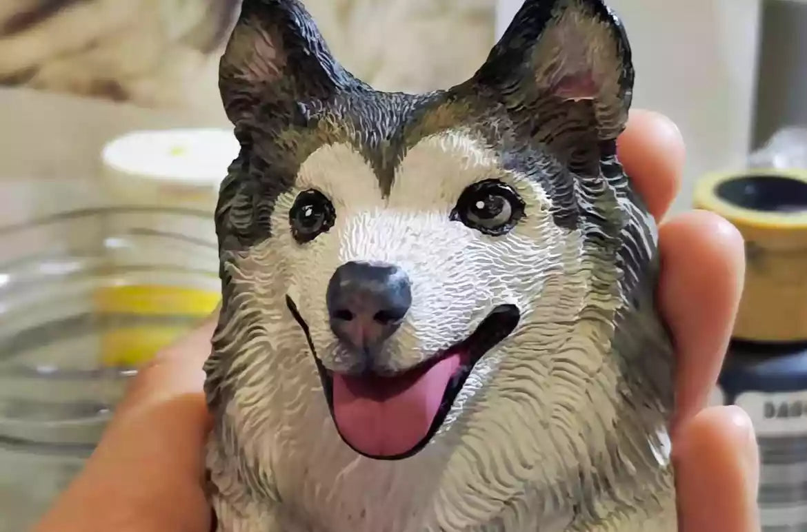 Close-up reference photo of a smiling black-and-white dog with its tongue out, used for a custom portrait frame.